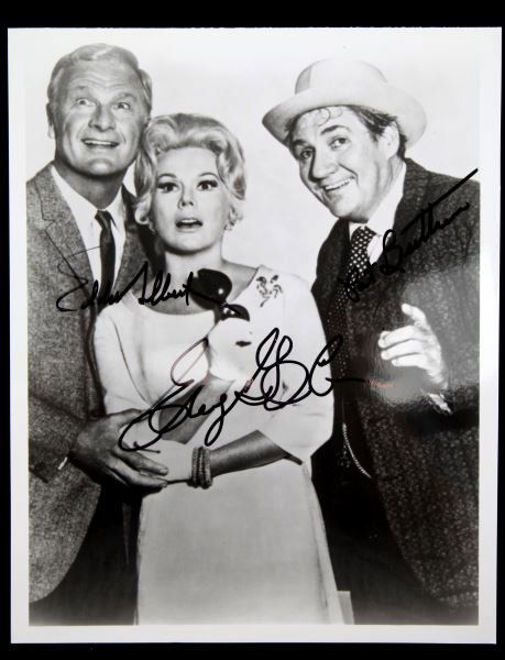 SIGNED PHOTO EDDIE ALBERT, EVA GABOR, PAT BUTTRUM: "Green Acres is the place to be...". 8x10 black and white publicity photo, with guaranteed authentic signatures of Eddie albrt, Eva Gabor and Pat Buttrum. In very good condition.