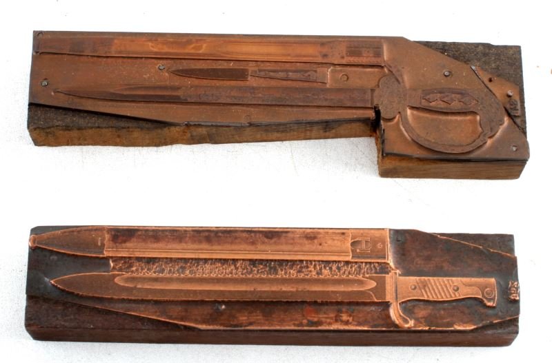 2 CARL EICKHORN FACTORY COPPER PRINTING CLICHES: 2 original Carl Eickhorn factory copper printing clichés. One depicts an Eickhorn Forestry Cutlass (#978) (6.5 inches) (deer and swan forest scene) and the other an Eickhorn Mauser bayonet with sawto
