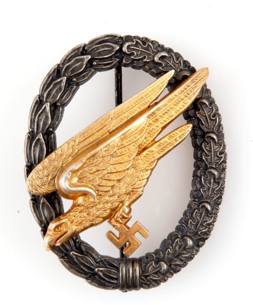 WWII GERMAN PARATROOPER FALLSCHIRMER BADGE: Thin vertical pin back to C clasp, rivet attached eagle, maker marked Sohn Berlin, solid unbending two part construction. Unauthenticated.