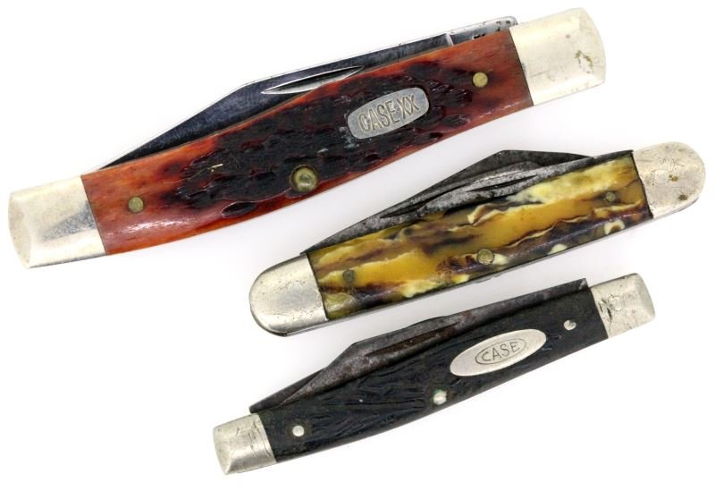 LOT OF 2 CASE KNIVES PLUS 1 OTHER: Two case pocket knives: One 3.5 inch overall length knife with two blades and one 2.5 inch overall length knife with two blades. One other 2.75 inch overall length knife with three blades. Some signs 