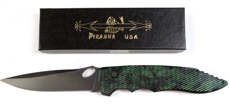 PIRANHA PREDATOR GREEN AUTOMATIC KNIFE: Piranha Predator green auto knife. 4.1 inch blade. The Piranha emblem appears on the handle. New in box.