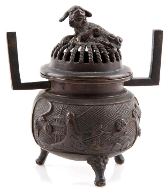 JAPANESE MEIJI PERIOD BRONZE KORO WITH SHISHI LID: Bronze censer (incense burner) with lid featuring Shishi lion fu dog figure. Stands 4.5 inches tall on three legs and 4.25 inches across attached handles handles (one loose). Landscape motif at waist.
