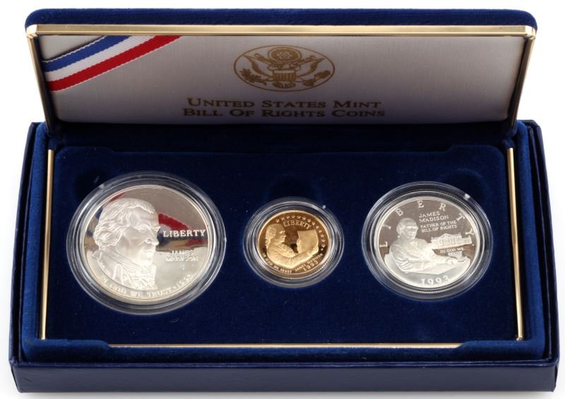1993 US MINT BILL OF RIGHTS COMMEMORATIVE COIN SET: US Mint issued 1993 Bill of Rights Commemorative three-coin Proof set. This set includes: silver dollar, gold five dollar coin, and silver half dollar coin. 90% fineness of gold and silver. The gold c