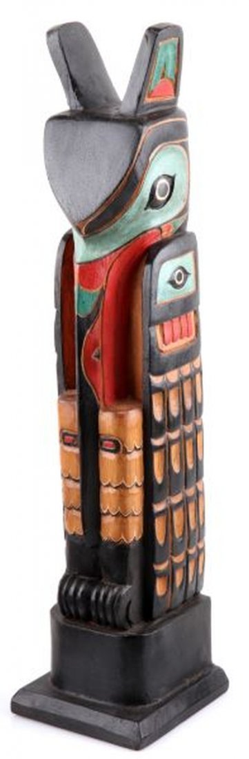 PACIFIC NORTHWEST COAST SINGLE FIGURE EAGLE TOTEM: Hand crafted wood carved single eagle totem. Color palette includes red, black, and some variant of green or blue. Unsigned, measures at 19 inches tall and base is 5 inches wide. In very good conditio