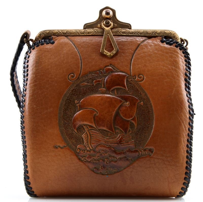 TEITZEL TOOLED LEATHER PURSE ART DECO SHIP: Antique tooled leather purse made by Teitzel. The frame is decorated with repeating geometric designs, and has a simple locking mechanism. The leather purse is adorned with a central image of a ship i
