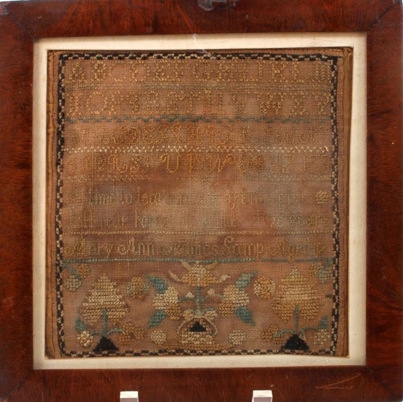 ANTIQUE VICTORIAN SAMPLER NAMED AGE 10 FRAMED: Antique sampler by Mary Ann Nahles aged 10. The sampler has two alphabets, numbers, her name and age, and a quote. The quote is barely legible. The bottom of the sampler is decorated with floral desig