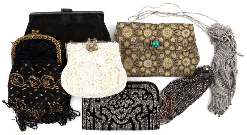 LOT OF SEVEN VINTAGE PURSES BEADED AND MESH: Lot of seven vintage purses. The first purse in this lot is a small white beaded purse with ornate marcasite clasp. The second purse is an unmarked silver plated mesh purse The third purse is a beaded