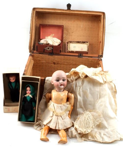 VINTAGE AND ANTIQUE BISQUE GERMAN & AMISH DOLL LOT: Lot of three vintage and antique dolls. The first doll is a German bisque doll with sleep eyes and teeth. This doll is missing hair, but is accompanied with a chest full of clothing. The doll's limbs 