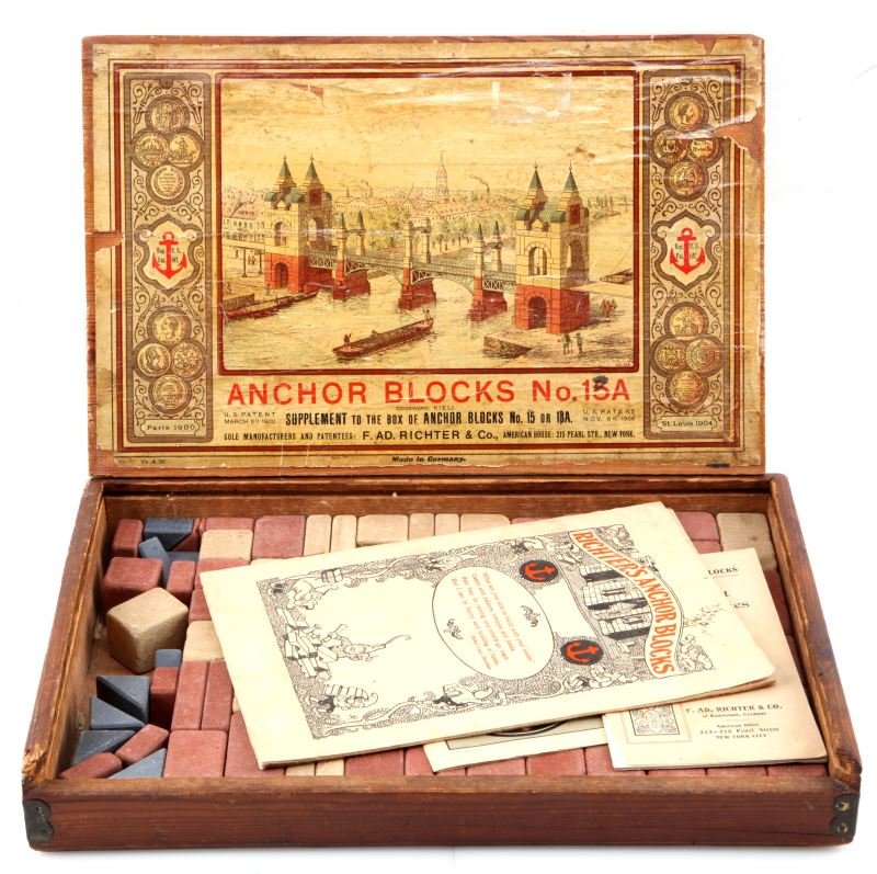 ANCHOR BLOCKS NO. 15A SUPPLIMENT BUILDING BLOCKS: Richter's Anchor Blocks In original wood box with label and diagram. Three booklets inside. Multi colored concrete building blocks. Early 20th century. In good to very good condition.