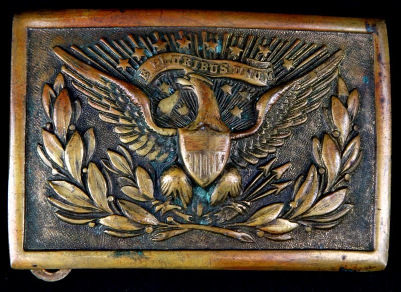 AMERICAN INDIAN WARS ERA EAGLE MEYER BELT BUCKLE: 2 by 3 inch U.S. Eagle belt buckle with "E Pluribus Unum" banner. Back catch is stamped with "N.S.MEYER.INC." / "NEW YORK" . In very good condition with honest wear to face of buckle at high points.