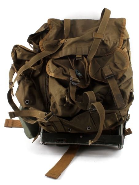 VINTAGE US ARMY BACKPACK FOLDING SPADE & LIGHT: Vintage United States army backpack. Folding spade attached in plastic container. Functional Fulton MX-991 flashlight. Named to Grimes. Backpack has signs of wear and use. Overall very good condition.