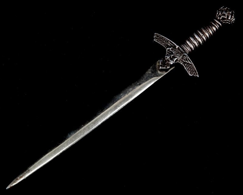 GERMAN MINIATURE MODEL LUFTWAFFE DAGGER: Model dagger measures approximately 8 inches in length. Some loss of finish and wear present to dagger; overall in very good condition.