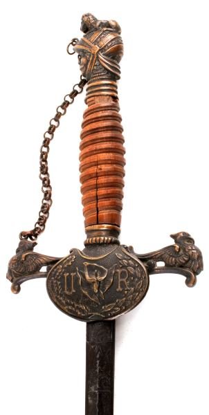 KNIGHTS OF PHYTHIAS FRATERNAL SWORD FCB: Knights of Phythias Fraternal sword. (FCB) in relief to one side of hilt, (U R) to front side. Knight's head pommel, threaded wood grip (missing wire), and embossed design to blade including (C.R. Mar