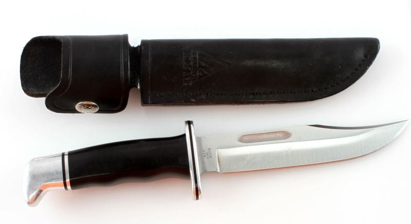 BUCK 119 HUNTING KNIFE WITH SHEATH: A Buck hunting knife, model 119. Includes original black leather sheath. Items are in very good used condition.