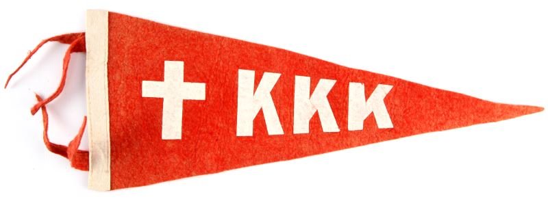 1920S KKK KU KLUX KLAN PENNANT BANNER: 1920s Ku Klux Klan pennant banner. Has a cross and "KKK" on face. Measures approximately 17.5x7 inches at widest dimensions. Tassels intact. No pin holes. Overall very good condition.