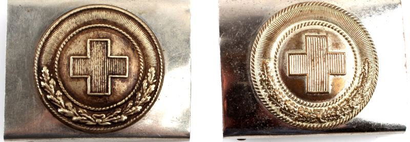 PRE-WWII GERMAN DRK RED CROSS BELT BUCKLE LOT OF 2: Lot of two pre-WWII German DRK, Red Cross, belt buckles with no apparent maker's mark. The buckles have a two piece construction, a white metal buckle with golden tones central fixture. The central fi