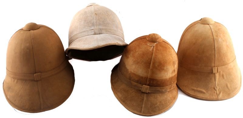 4 SPANISH AMERICAN WAR MILITARY SUN PITH HELMETS: Group of 4 US Military Sun Pith helmets. Includes 3 tan and one white. Made of cotton twill and cork with green interior and leather band. Sizes are 6 7/8 and 7 1/8, one is unmarked. Overall very good