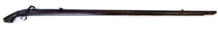 JAPANESE MATCHLOCK CONVERTED TO PERCUSSION RIFLE: 62 inches overall length, 53 inch barrel. Fixed front and rear sights. Early conversion to percussion. No markings aside from the brass chrysanthemum escutcheons on the full length stock. Overall cond