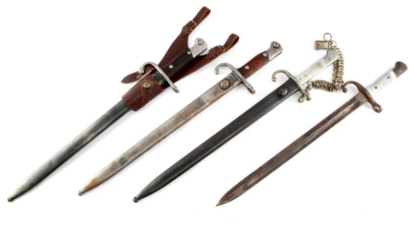 LOT OF FOUR ARGENTINE GERMAN MADE 1909 BAYONETS: A lot of four model 1909 Argentine bayonet. Three of them have matching scabbard and crossguard serial numbers. One is without a scabbard, one has a chain belt, and the an other has a leather frog. Al