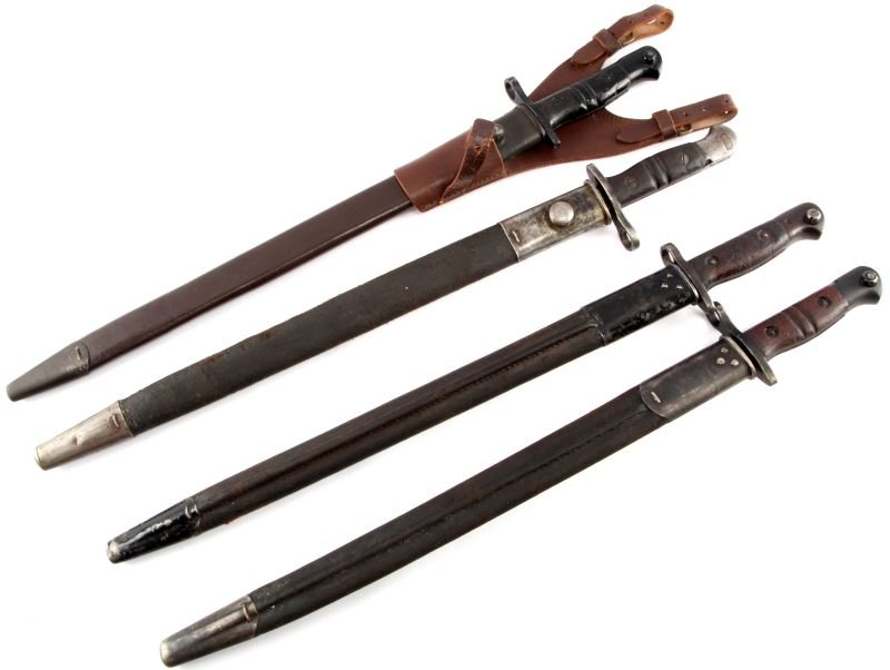 LOT OF FOUR FRENCH BAYONETS 1874 AND 1886 MODELS: Lot of four French bayonets. Three 1866 models with scabbards, one has a damaged scabbard and the blade cant be fully inserted. One 1874 bayonet with scabbard and leather frog. All items are in good c