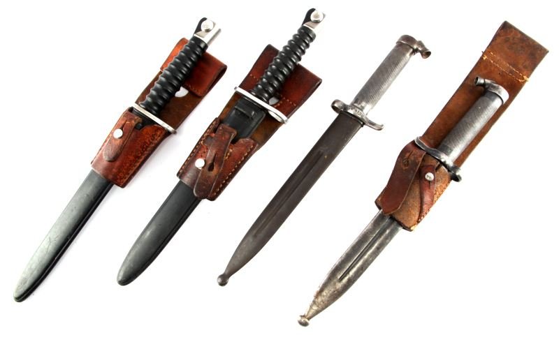 LOT OF 2 SWISS SIG 57 AND 2 SWEDISH 1896 BAYONETS: A lot of four bayonets; two Swedish 1896 bayonetsand two SIG 57 bayonets. Both Swiss bayonets have thier original leather frogs. One of the Swedish bayonets has its leather frog. All items are in good