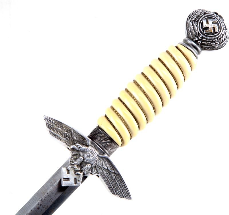 WWII THIRD REICH 2ND MODEL LUFTWAFFWE DAGGER: Second model Luftwaffe dagger with white grip. No maker's mark. Round pommel with swastika and oak wreath. Pebbled scabbard with oak leaf decorations. Item is in very good condition. Measures 17 inche