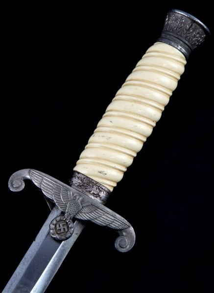 WWII GERMAN THIRD REICH ARMY DAGGER WEHRMACHT HEER: An army dagger with no maker's mark. Bone-white grip is in good condition, no chips or cracks. Hilt's hardware has nice patina that highlights detail. Blade has original cross grain and some runner ma