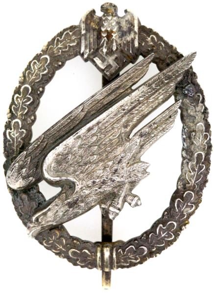 WWII 3RD REICH GERMAN ARMY PARATROOPER BADGE RARE: Rare early German Army Paratrooper badge. Made in 800 silver with bearded eagle to top, exceptional detail to Third Reich eagle in relief. Engraved (Fallschirm - Inf. Komp, Fag. Biernd) to reverse per