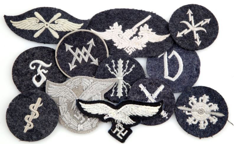 WWII GERMAN LUFTWAFFE SLEEVE PATCHES GROUP OF 12: WWII German Luftwaffe Air Force patches. Radio operator, telephone operator, Mechanic's patch, Administration NCO patch, Navy medic, Luftwaffe eagle, Flying Personnel, Artillery, and more. One has met