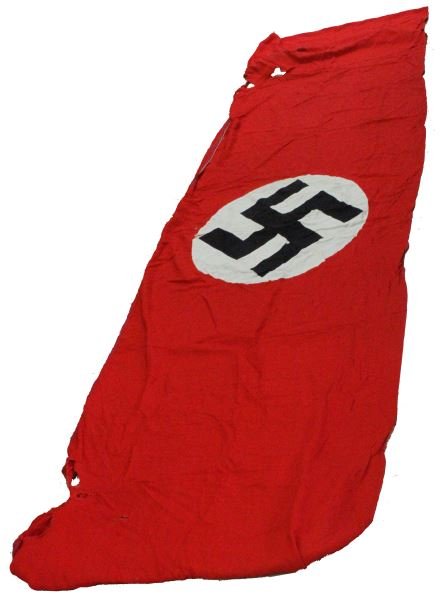WWII THIRD REICH LARGE NSDAP STREET BANNER: A large (220 by 45 inches) NSDAP street banner. Red field with swastika in white circle on center. Has some holes and wear from use. The upper edge is fitted with metallic rings to hold a halyard for