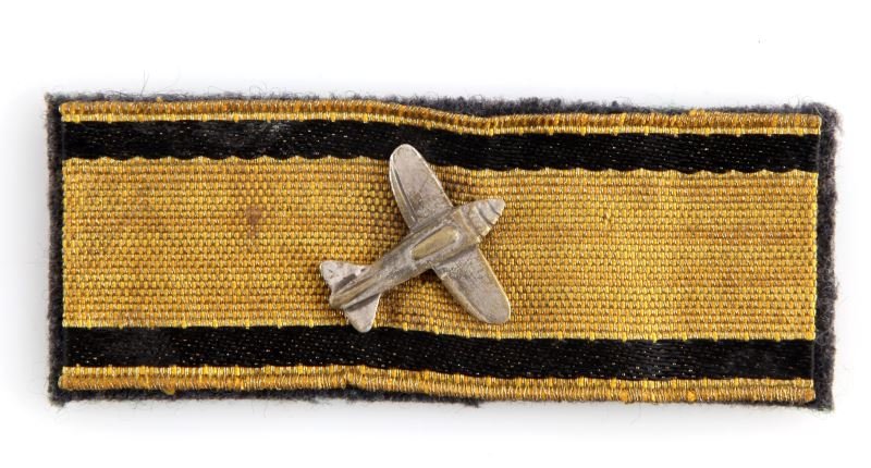 WWII LOW FLYING AIRCRAFT DESTRUCTION BADGE IN GOLD: Third Reich low aircraft destruction medal in gold. Awarded for single-handedly destroying 5 low flying aircraft using hand weapons. Features a metallic aircraft on a gold bouillon band embroidered wi