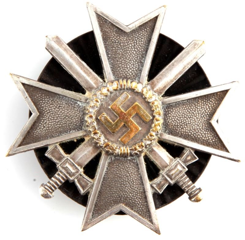 WWII THIRD REICH WAR MERIT BADGE 1ST CLASS: A screw back example of a WWII War Merit Cross with Swords. No maker's marks. Some wear to silver wash, but in overall good condition. From the collection of Dr. J. Diggs.
