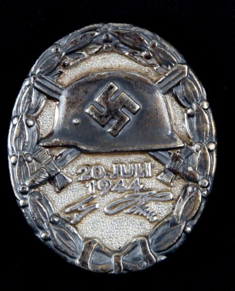 WWII GERMAN THIRD REICH 20 JULI 1944 WOUND BADGE: Has wide vertical barrel pin with a C hitch, reverse is maker marked 800 2. The construction of this badge is near flawless. Extremely rare issue. This lot has a reserve.