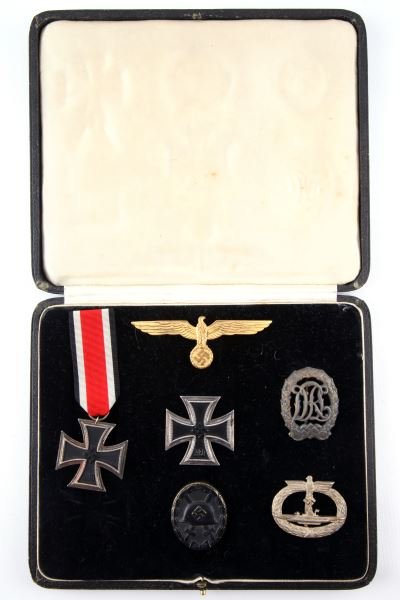 WWII GERMAN NAMED IRON CROSS U BOAT MEDAL GROUPING: An important grouping of medals named to LT. Zur See Karl-Robert Belz of U boat 87. Medals listed are stored/displayed in a period black leatherette case with silk inside lid and velvet lower. Medals