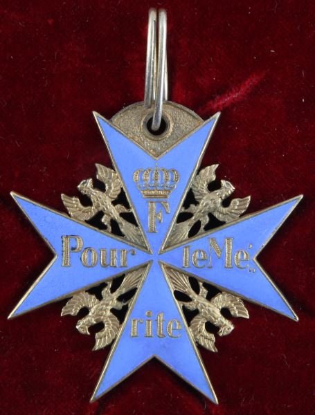 PRUSSIAN POUR LE MERITE MEDAL IN CASE WITH RIBBON: Prussian Pour Le Merite medal in case with ribbon. An "F" and "Pour le Merite" appear on the face. Designed with French writing--the preferred language of Frederick II's eighteenth century court. "JG&