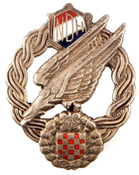 CROATIAN USTASHA LUFTWAFFE PARATROOPER BADGE: World War II-era Croatian Ustasha Luftwaffe paratrooper badge. The Ustasha were a fascist revolutionary movement in Croatia. The design on this badge is similar to the German Luftwaffe paratrooper bad