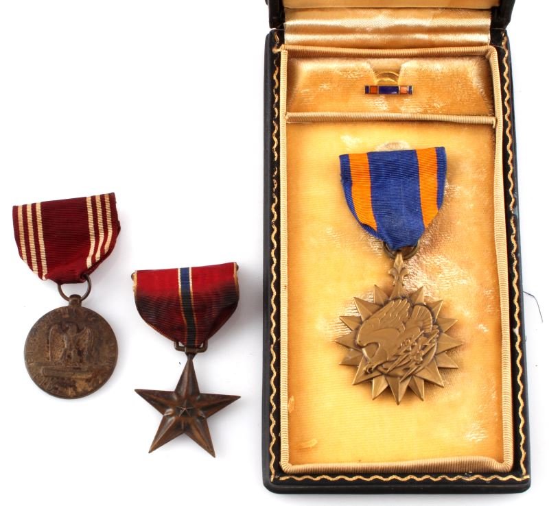 WWII NAMED BRONZE STAR PLUS AIR MEDAL AND MORE: A lot of three WWII era medals. One named bronze star awarded to John W. Bell. In good condition with some staining on the ribbon. One Air Medal attributed to Lt. Col. Chapel in very good condition wi