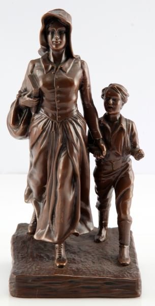 JENNINGS BROTHERS PIONEER WOMAN BRONZE SCULPTURE: A Jennings Brothers bronze depicting a pioneer woman and her son. Smaller version of statue erected by Bryant Baker in Ponka City, Oklahoma to honor the American pioneer woman. Measures 9.5 inches tal