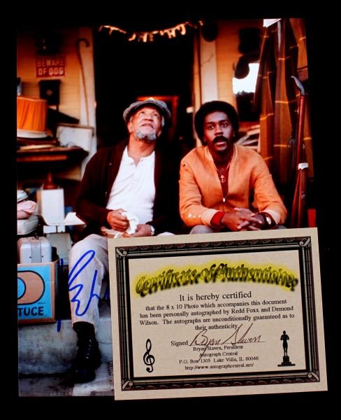 AUTOGRAPHED PHOTO OF REDD FOXX AND DEMOND WILSON: Guaranteed authentic autographs on 8x10 lab photo of Sanford and Son stars Redd Foxx as Fred G. Sanford, a widower and junk dealer living at 9114 S. Central Ave. in the Watts neighborhood of South Cen