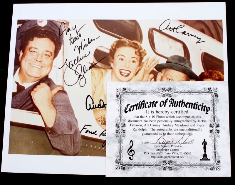 SIGNED PHOTO OF CAST FROM TV'S "THE HONEYMOONERS": 8x10 color lab photo, in very good condition, with guaranteed authentic autographs of Jackie Gleason, Art Carney, Audrey Meadows, and Joyce Randolph, the cast of television's "The Honeymooners".