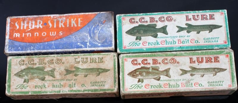 3 CREEK CHUB AND 1 SHUR STRIKE LURE BOXES: Three Creek Chub lure boxes and one Shur Strike lure box. Boxes only. Expected signs of age and wear.