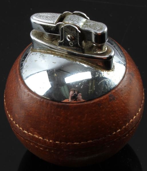 RONSON RONDELIGHT LEATHER CHROME BALL LIGHTER: Ronson Rondelight leather chrome ball lighter. Made in England. Small dent on chrome. Needs replacement flint. Overall very good condition.