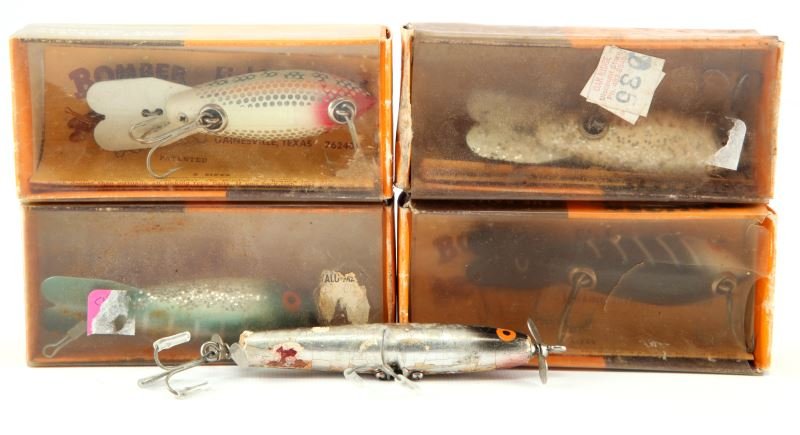 4 BOMBER BOXES W LURES & 1 OTHER BOMBER LURE: Four Bomber boxes with lures and one other Bomber lure. Expected signs of age and wear.