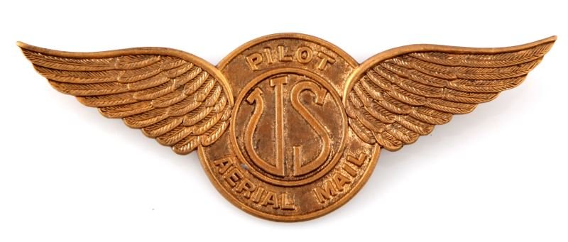 US AERIAL MAIL PILOT WINGS 1922-1926: Early Air Mail pilot wings, given to Post Office Aerial mail pilots circa 1922-1926. This pin has no maker's mark. Brass construction. Thin horizontal pin with safety on "c" catch. 3.5 inches wide.