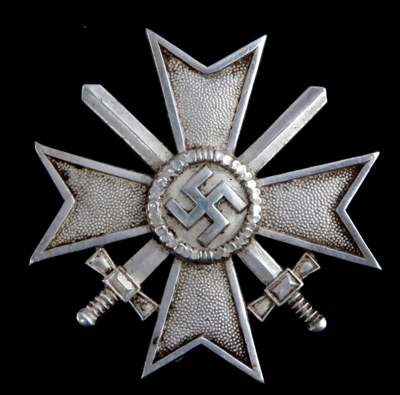 WAR MERIT CROSS W SWORDS 1ST CLASS WWII GERMAN: Third Reich German World War II War Merit Cross with Swords, 1st class. This badge was awarded to military personnel for valor and achievements. The design is made up of three items; a pebbled Maltese