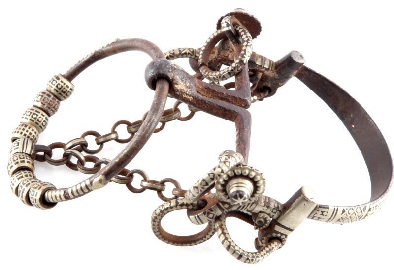 ANTIQUE PAINTED HORSE BRIDLE SMALL SIZE: Antique painted small horse bridle possibly Gaucho or Moorish. Painted with silver geometric designs. Measures 9 inches long by 7 inches wide.