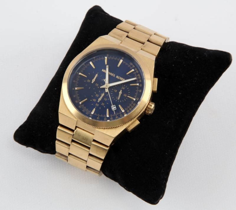 MENS MICHAEL KORS GOLD PLT BLUE DIAL WATCH MK8338: In very good running condition, men's Michael Kors MK8338. Gold tone. Round case 43mm .Blue dial. Chronograph function. Luminous markers. Three sub dials. Water resistant 10 ATM. Feather scratches onl