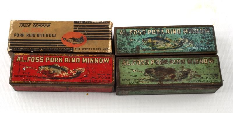 4 VINTAGE AL FOSS BOXES WITH FISHING LURES: Four vintage Al Foss boxes with fishing lures: three metal boxes with lures (blue, red, and green) and one Al Foss True Temper box with lure. Expected signs of age and wear.