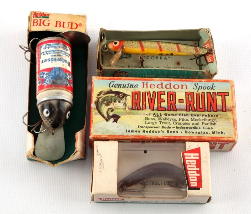 4 VINTAGE HEDDON BOXES WITH FISHING LURES: Four vintage Heddon boxes with lures: One River-Runt box with lure circa 1947, one Heddon box with Prowler lure, one Heddon box with Cobra lure, and one Heddon box with Bud lure. Expected signs of age