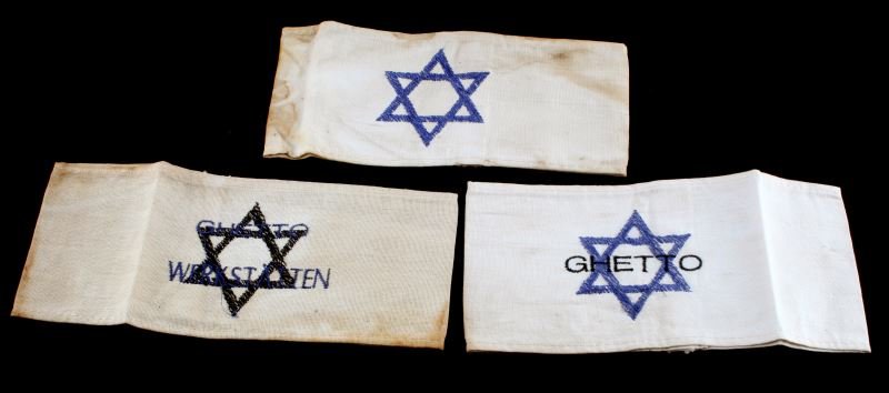 GROUP OF 3 HOLOCAUST ARMBANDS STAR OF DAVID GHETTO: Lot of three holocaust armbands: Star of David, ghetto, and ghetto workshop. Expected signs of age and wear. Presumed reproduction.